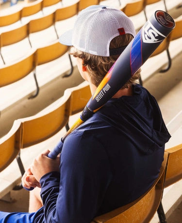 Player holding a 2025 Louisville Slugger Select PWR™ -3 BBCOR Baseball Bat