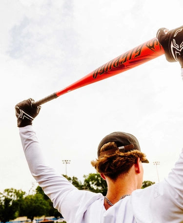 Player preparing to bat with the 2025 Louisville Slugger Dynasty -3 BBCOR Baseball Bat