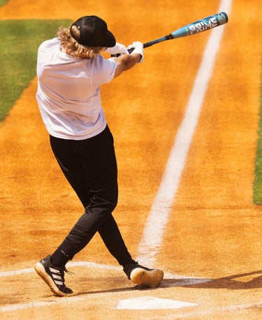 Player using the 2025 Louisville Slugger META® Prime -5 USSSA Baseball Bat on the field