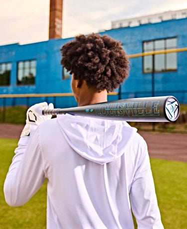 Player holding the 2025 Louisville Slugger Omaha -3 BBCOR Baseball Bat