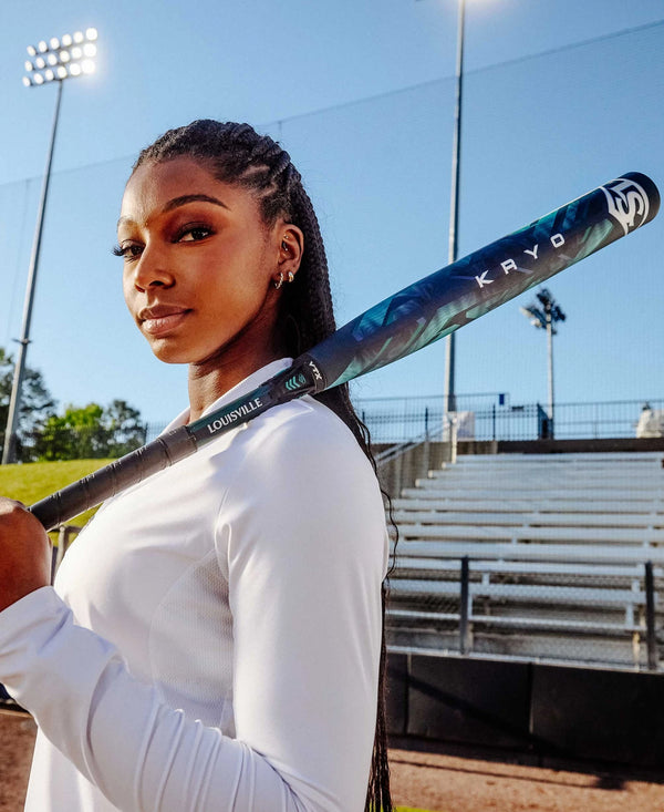 Elite fastpitch player holding the 2025 Louisville Slugger KRYO -11 Fastpitch Bat