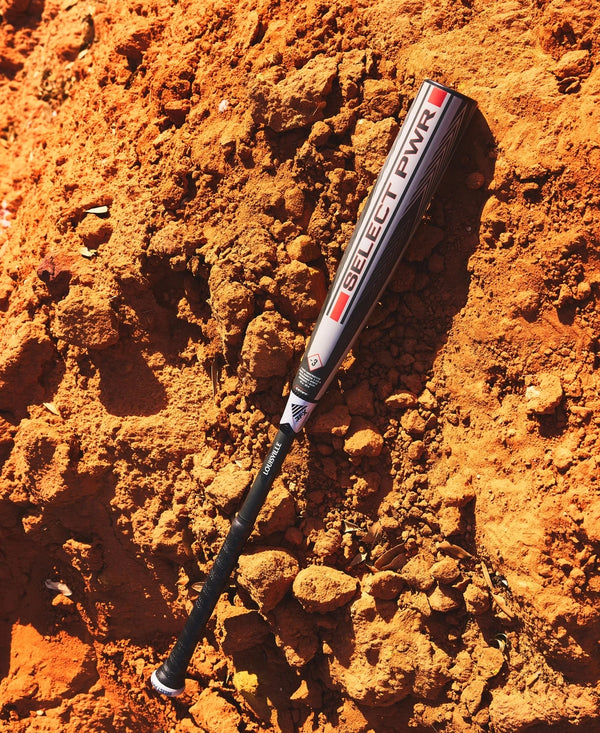 2026 Louisville Slugger Select PWR™ -3 BBCOR Baseball Bat laying in the field