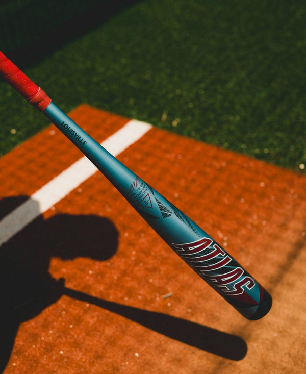 Player in the shadows preparing to hit with the 2026 Louisville Slugger Atlas™ -3 BBCOR Baseball Bat, shown in the light