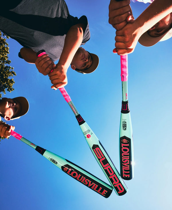 Three players displaying their 2026 Louisville Slugger Supra™ USSSA Baseball Bats