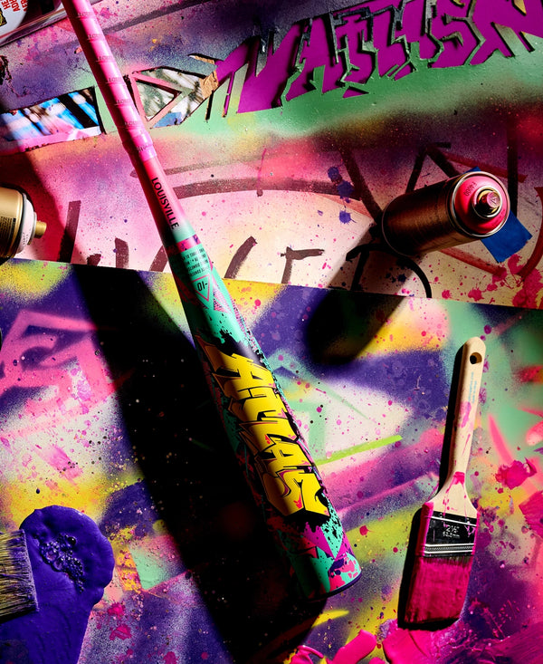 2026 Louisville Slugger Atlas™ Wildstyle -3 BBCOR Baseball Bat amidst a backdrop of colorful graffiti