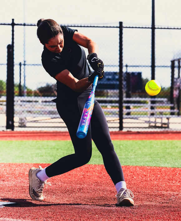 Player hitting with the 2026 Louisville Slugger KRYO Love The Moment™ Fastpitch Bat