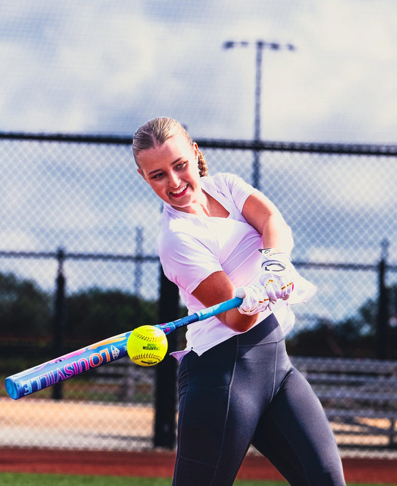 Player hitting with the 2026 Louisville Slugger KRYO Love The Moment™ Fastpitch Bat