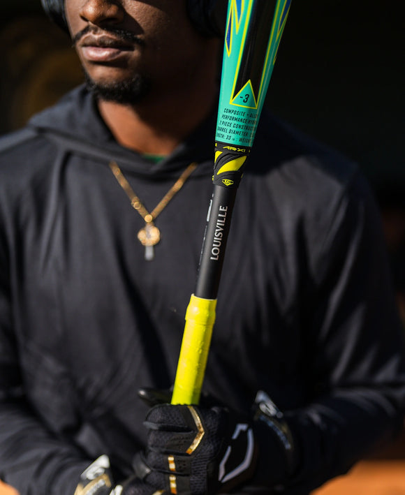 Player shouldering the 2026 Louisville Slugger Atlas™ Hybrid Green -3 BBCOR Baseball Bat