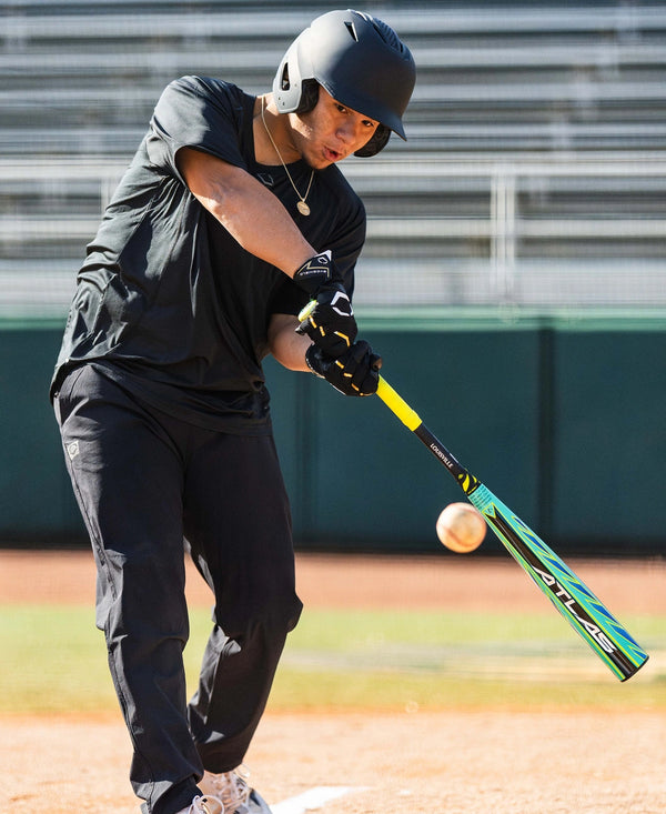 Player swinging the 2026 Louisville Slugger Atlas™ Hybrid Green -3 BBCOR Baseball Bat
