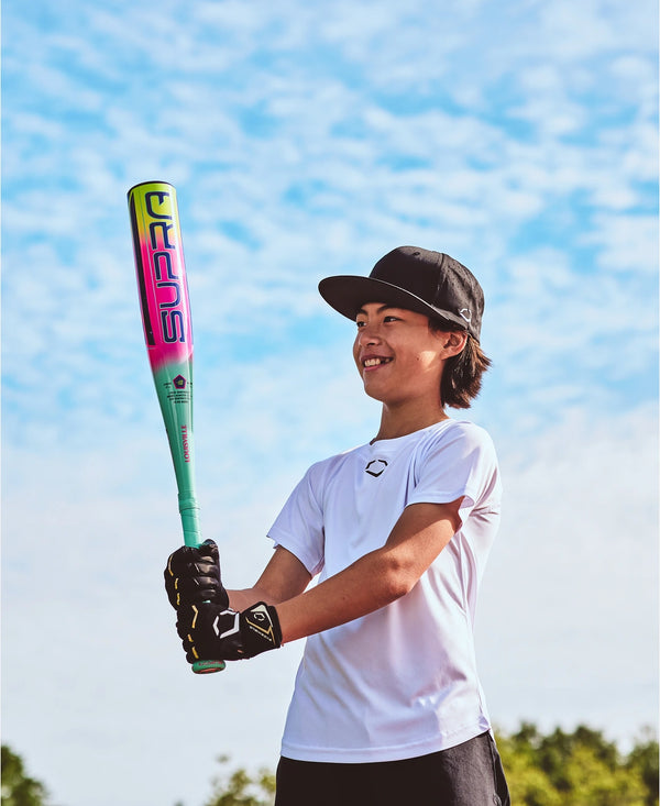 Young player holding the 2027 Louisville Slugger Supra™ Junior Big Barrel -10 USSSA Baseball Bat