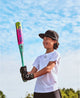 Young player holding the 2027 Louisville Slugger Supra™ Junior Big Barrel -10 USSSA Baseball Bat