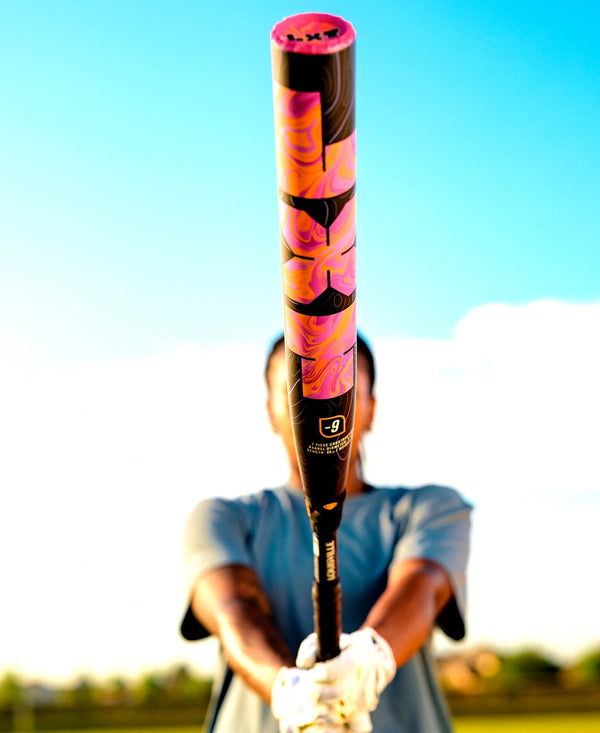 Player getting ready to bat with the 2027 Louisville Slugger LXT® Fastpitch Bat