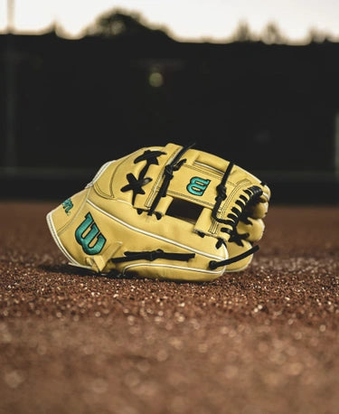 Wilson Fall 2024 A2000® FP75 11.75" Fastpitch Glove resting on the infield