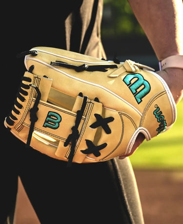 Player wearing the Wilson Fall 2024 A2000® FP75 11.75" Fastpitch Glove on the field