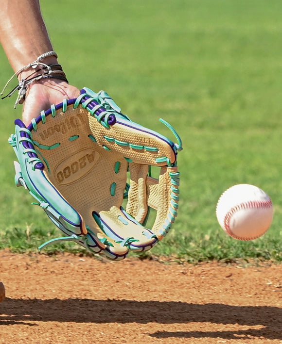 Wilson Winter 2025 A2000® SC1786 11.5" Baseball Glove on a players hand as he is about to field a ground ball
