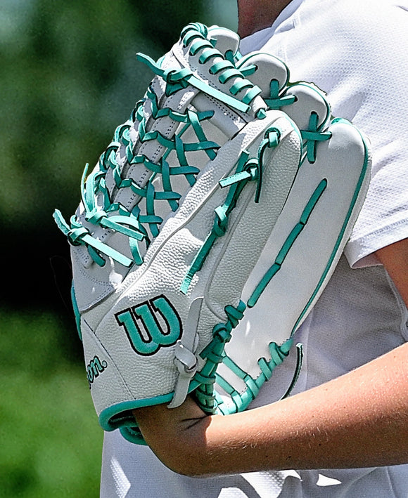 Player wearing the Wilson A1000® T125 12.5" Fastpitch Glove in the field