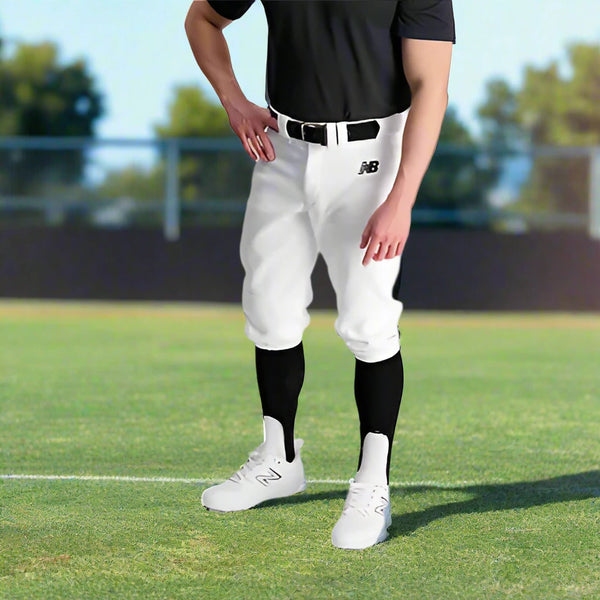 Player modeling the New Balance Adversary 2.0 Solid Knicker Baseball Pants