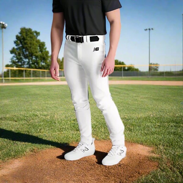 Player modeling the New Balance Adversary 2.0 Solid Tapered Baseball Pant