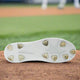 View of the sole of the New Balance FuelCell Ohtani 1 Metal Cleat - White/Metallic Gold