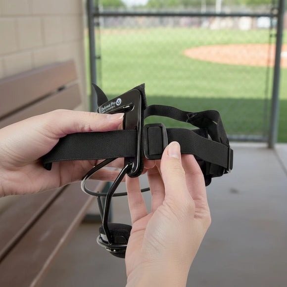 Person adjusting the Rip-It Pony Tail Strap for Softball Fielder's Mask