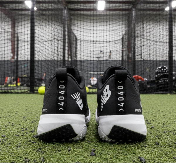 Rear view of the New Balance FuelCell 4040 v8 Turf Trainer - Black/White