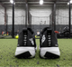 Rear view of the New Balance FuelCell 4040 v8 Turf Trainer - Black/White
