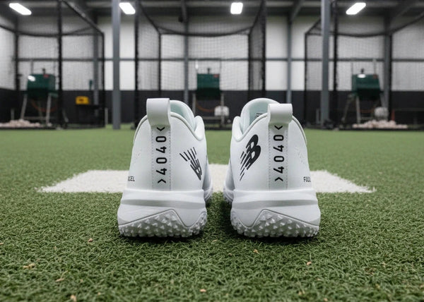 Rear view of the New Balance FuelCell 4040 v8 Turf Trainer - White/Black