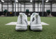 Rear view of the New Balance FuelCell 4040 v8 Turf Trainer - White/Black