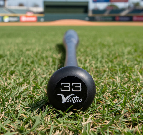 Close-up of the knob on the Victus Pro V Cut Flat Maple Wood Baseball Bat - Charcoal