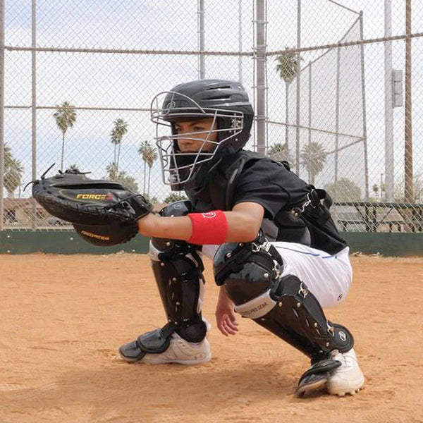 Catcher in an athletic stance with gear on
